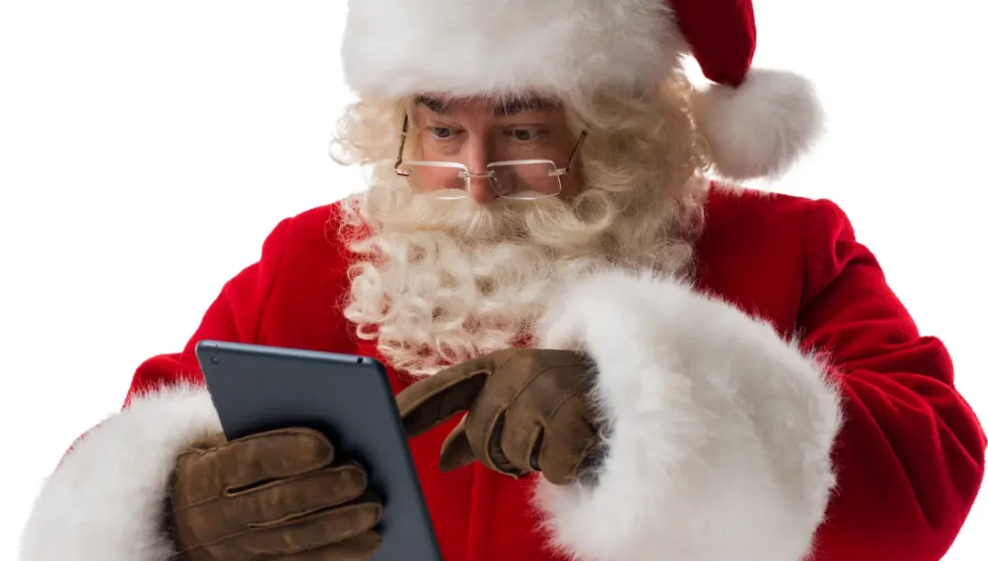 Santa reading a tablet